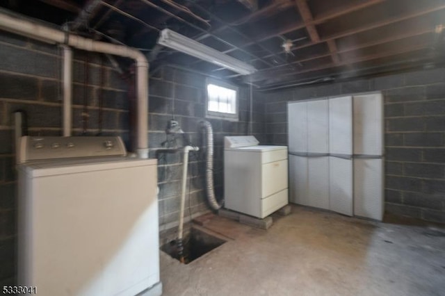 basement with washing machine and clothes dryer