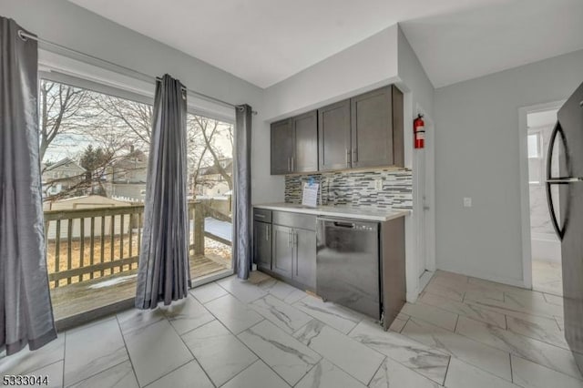 kitchen featuring decorative backsplash, dark brown cabinetry, and black appliances