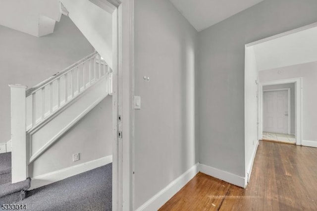 hall with dark hardwood / wood-style floors