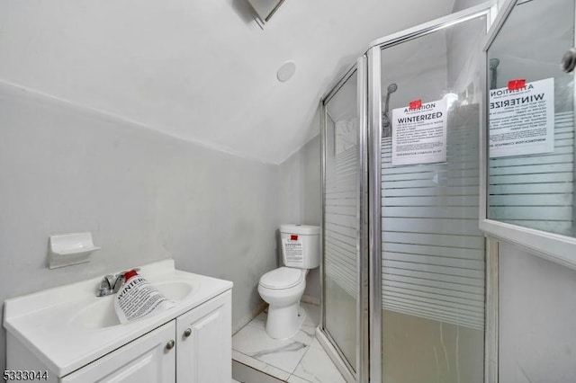 bathroom featuring toilet, vaulted ceiling, an enclosed shower, and vanity