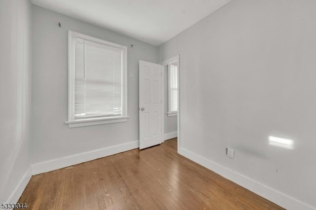 unfurnished room featuring wood-type flooring