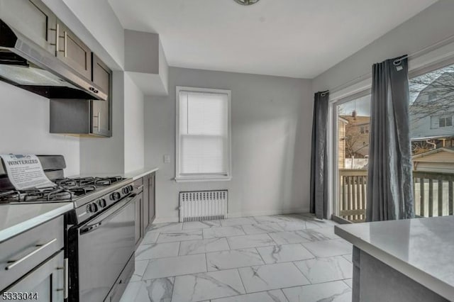 kitchen with radiator and stainless steel gas stove