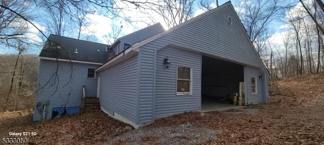 view of side of home with a garage