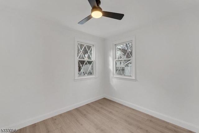 unfurnished room featuring ceiling fan and light hardwood / wood-style flooring