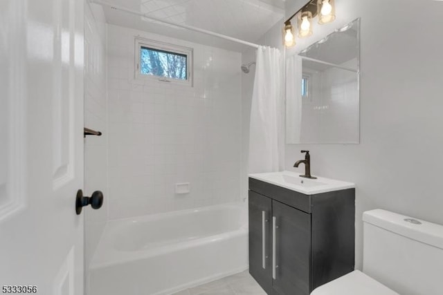 full bathroom featuring shower / bathtub combination with curtain, tile patterned floors, vanity, and toilet