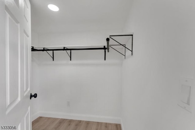 walk in closet featuring light hardwood / wood-style floors