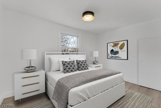 bedroom featuring wood-type flooring