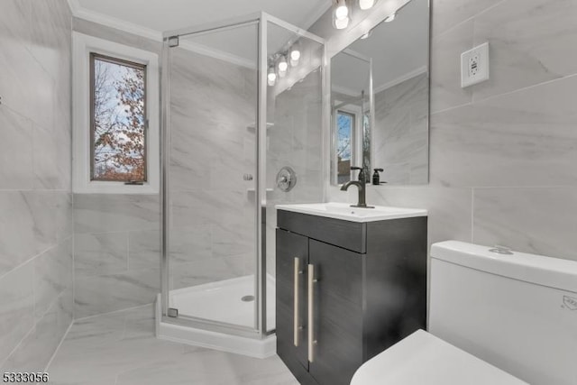 bathroom featuring toilet, vanity, and plenty of natural light