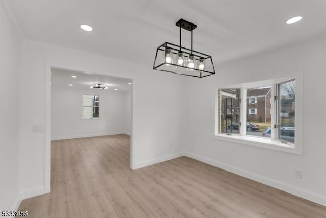 unfurnished dining area with light wood-type flooring