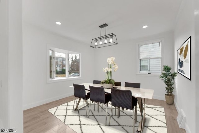 dining space featuring light hardwood / wood-style floors