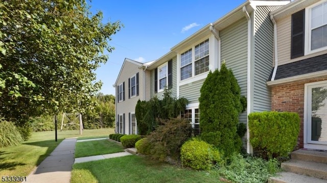 view of home's exterior featuring a yard