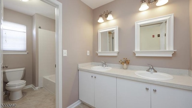 full bathroom featuring toilet, vanity, bathtub / shower combination, and tile patterned floors