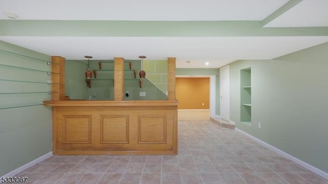 kitchen featuring kitchen peninsula and built in features