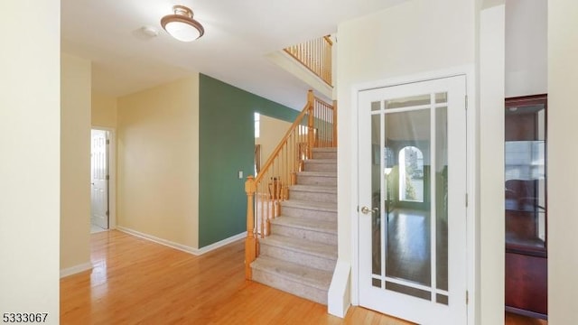 stairway with wood-type flooring