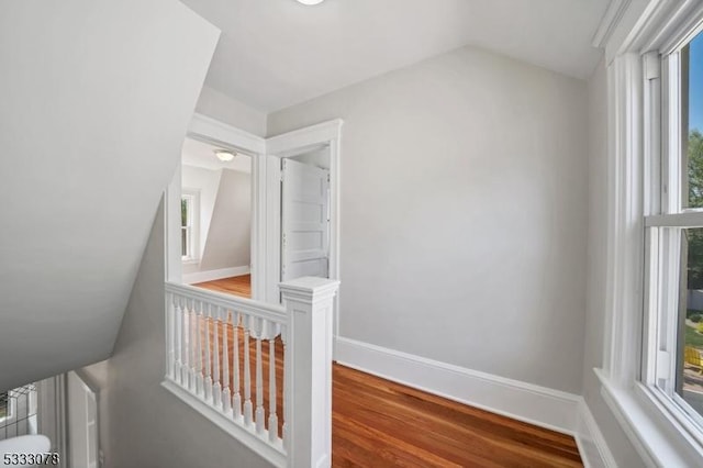 corridor with wood-type flooring