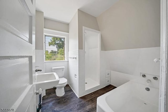 bathroom featuring toilet, independent shower and bath, and hardwood / wood-style floors