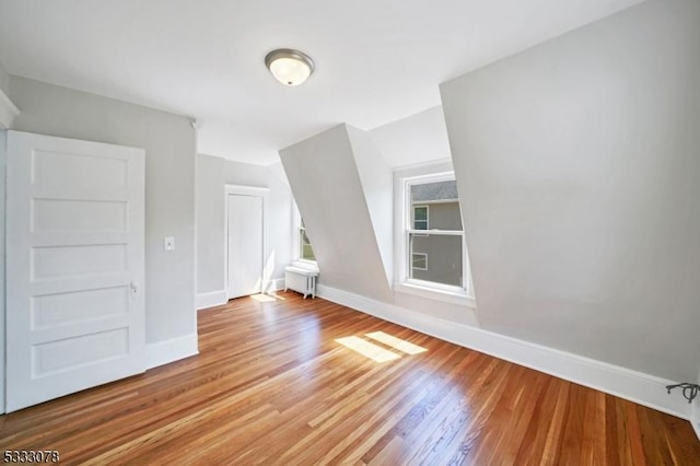 bonus room featuring hardwood / wood-style floors