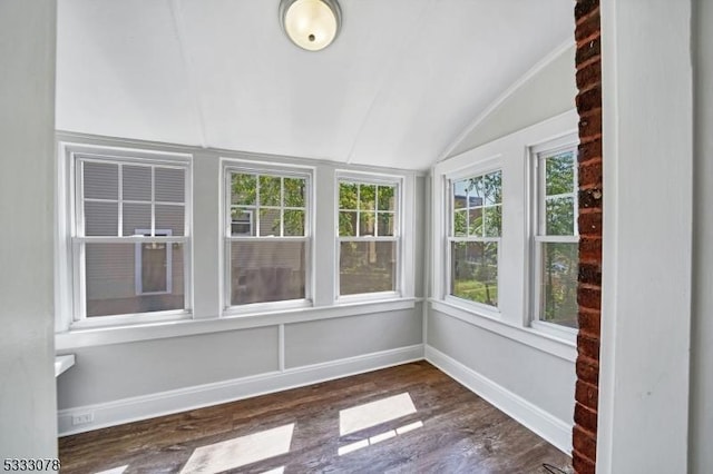 unfurnished sunroom with lofted ceiling