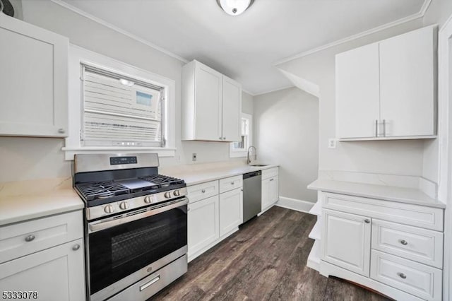 kitchen with sink, stainless steel appliances, and white cabinetry