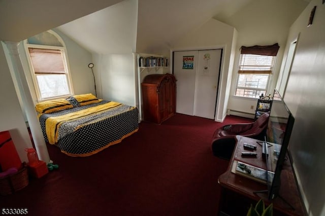 bedroom featuring a baseboard heating unit, carpet, and lofted ceiling