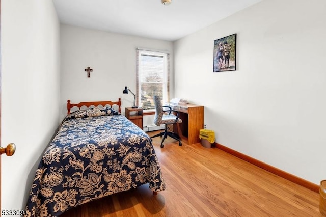 bedroom featuring wood-type flooring