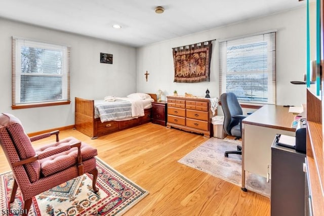 bedroom with hardwood / wood-style flooring