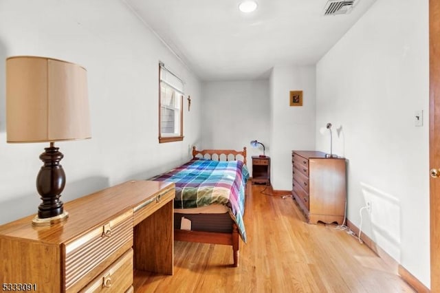 bedroom with light hardwood / wood-style flooring