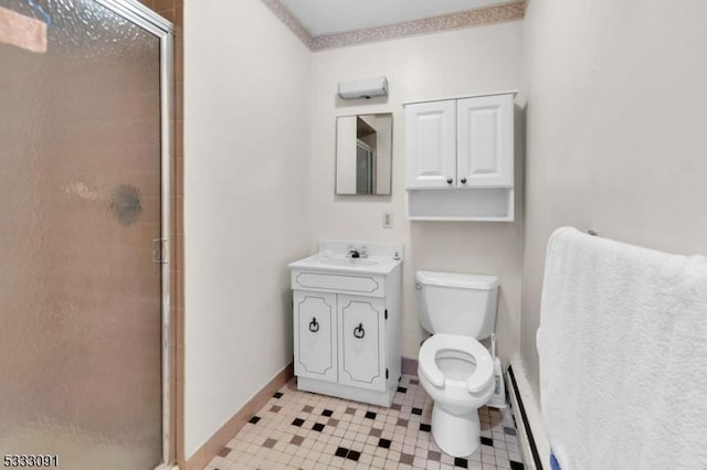 bathroom featuring a baseboard heating unit, a shower with door, toilet, and vanity