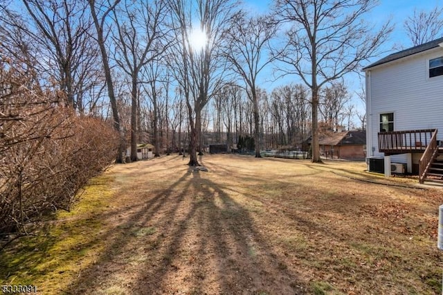 view of yard featuring a wooden deck