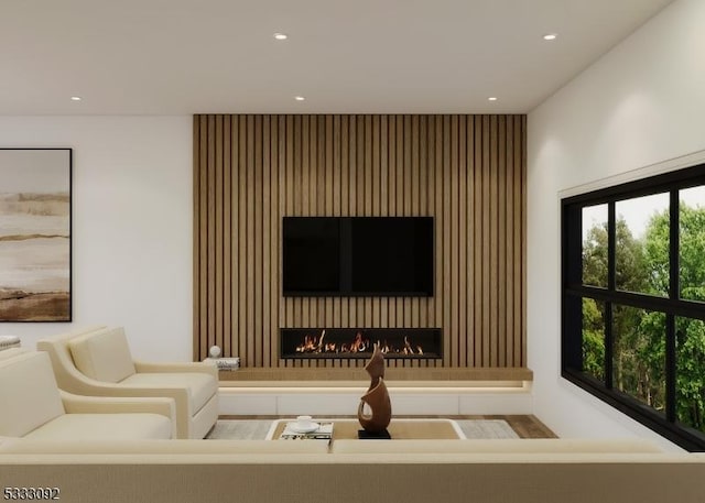 living area featuring a fireplace and recessed lighting