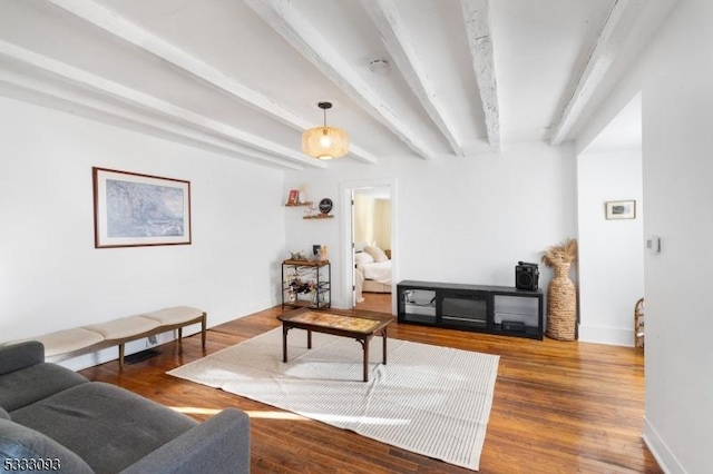 living room with wood-type flooring and beamed ceiling