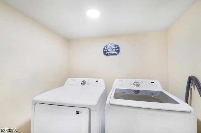 laundry room featuring washing machine and clothes dryer