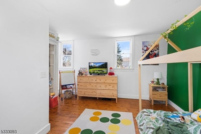 bedroom with hardwood / wood-style flooring