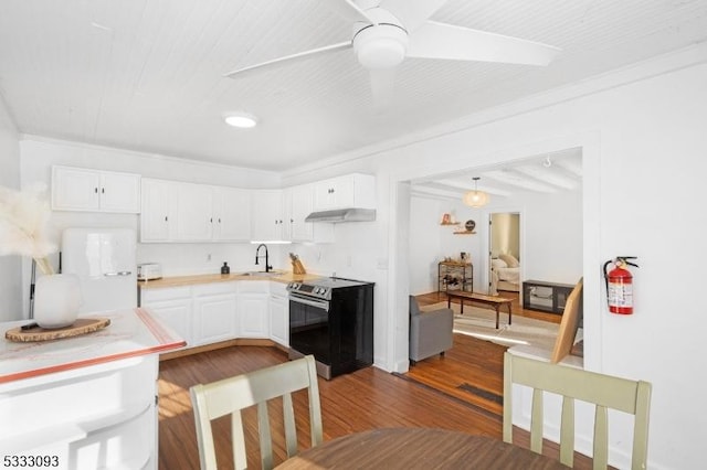 kitchen with hardwood / wood-style flooring, crown molding, white cabinets, and stainless steel electric range oven