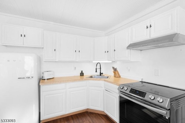 kitchen with white fridge, white cabinetry, stainless steel electric range, crown molding, and sink