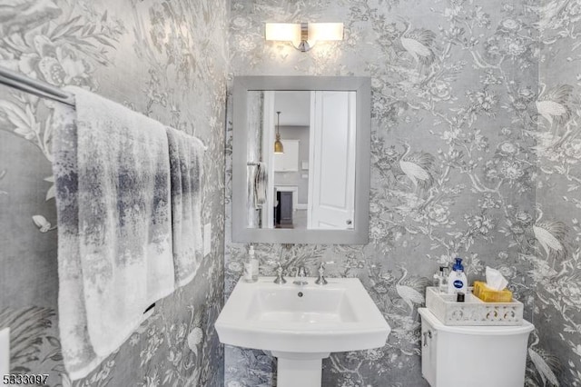 bathroom featuring sink and toilet