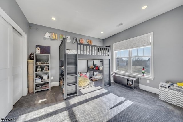 carpeted bedroom featuring a closet