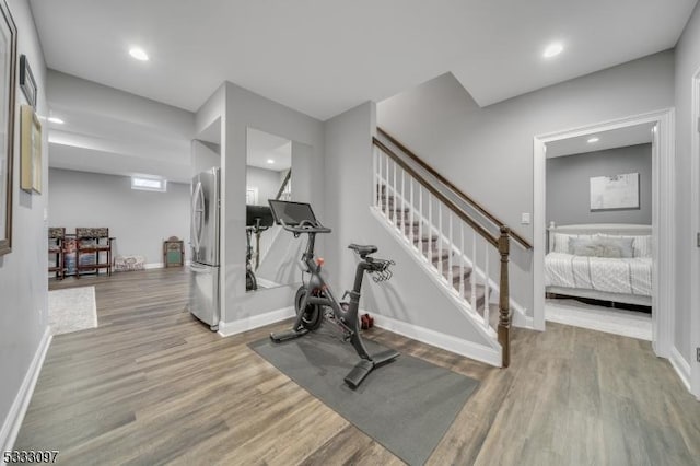 workout area featuring light wood-type flooring