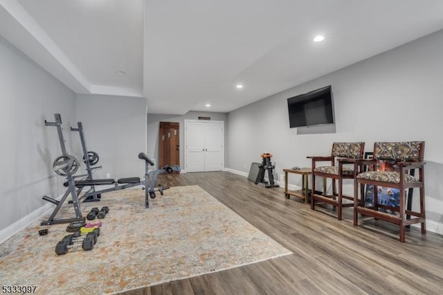 exercise area with hardwood / wood-style flooring