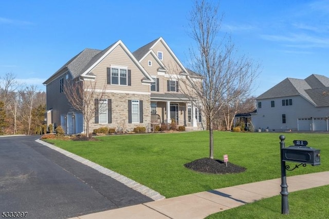 craftsman-style house with a front lawn