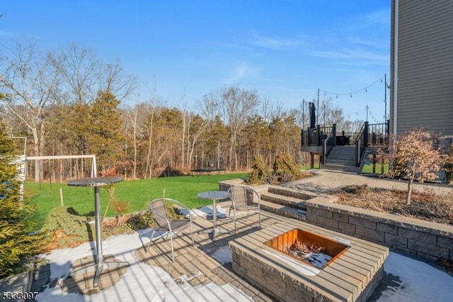 view of patio featuring a fire pit