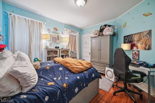 bedroom with dark hardwood / wood-style floors