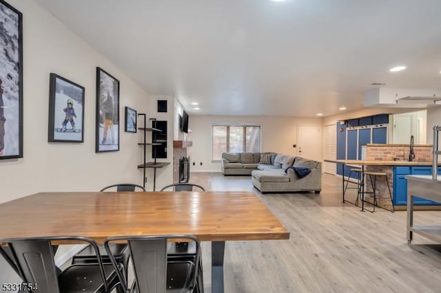 dining area with light hardwood / wood-style flooring