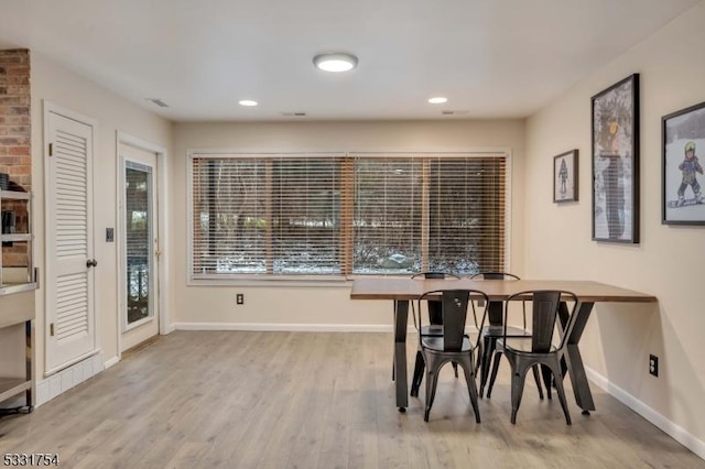 dining room with light hardwood / wood-style floors