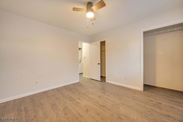 unfurnished bedroom featuring ceiling fan, a closet, and light hardwood / wood-style floors