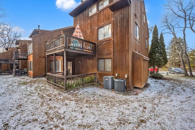 snow covered house with cooling unit