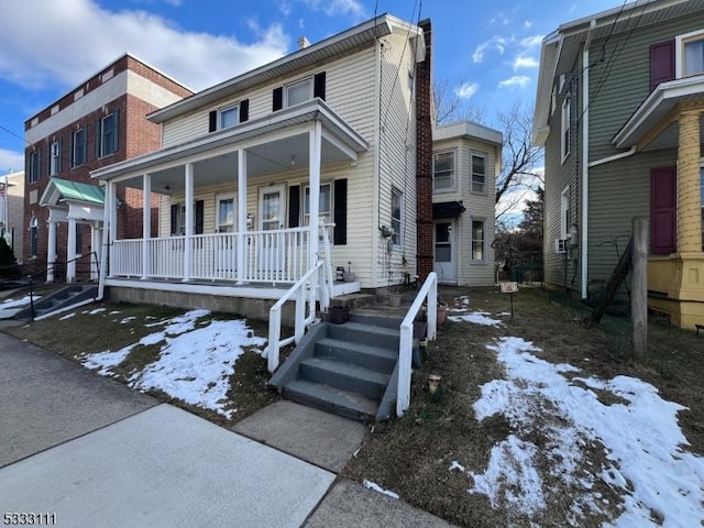 view of front of home featuring covered porch