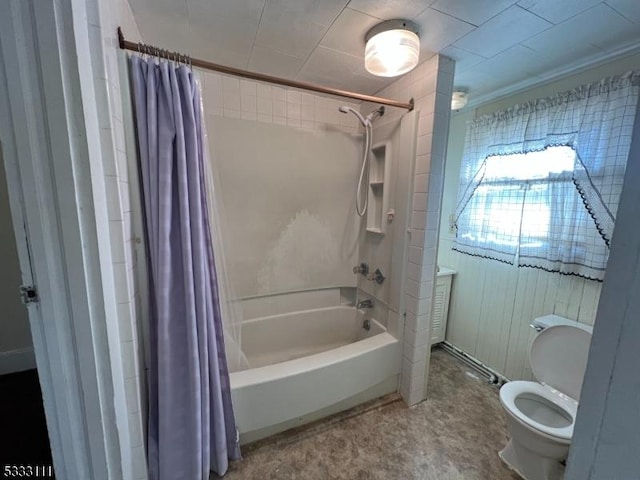 bathroom featuring toilet and shower / tub combo with curtain