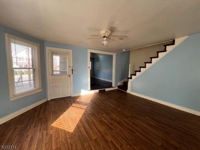 entryway with ceiling fan and dark hardwood / wood-style flooring