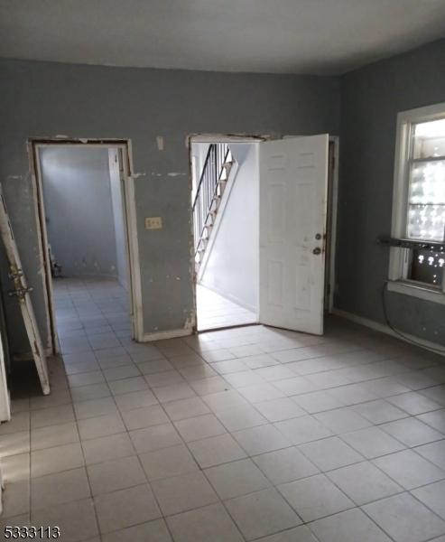 interior space with light tile patterned floors